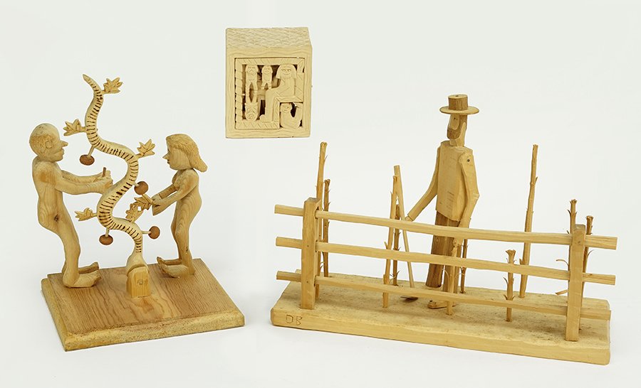 A Group of Carved Wood Sculptures.: A Group of Carved Wood Sculptures. Comprising a DB Strawser sculpture of a farmer in a field (initialed), a Rev. Herman Hayes figural puzzle box (signed and dated 1990), and an unsigned figural group 