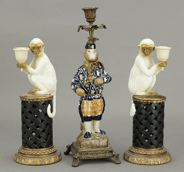 A Patinated Metal Monkey Form Candlestick. (1 of 1)