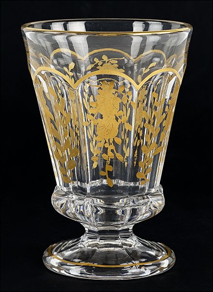 A French Gilt Crystal Beaker.: A French Gilt Crystal Beaker. Floral gilt decoration along the faceted exterior 5.5" x 3.75"