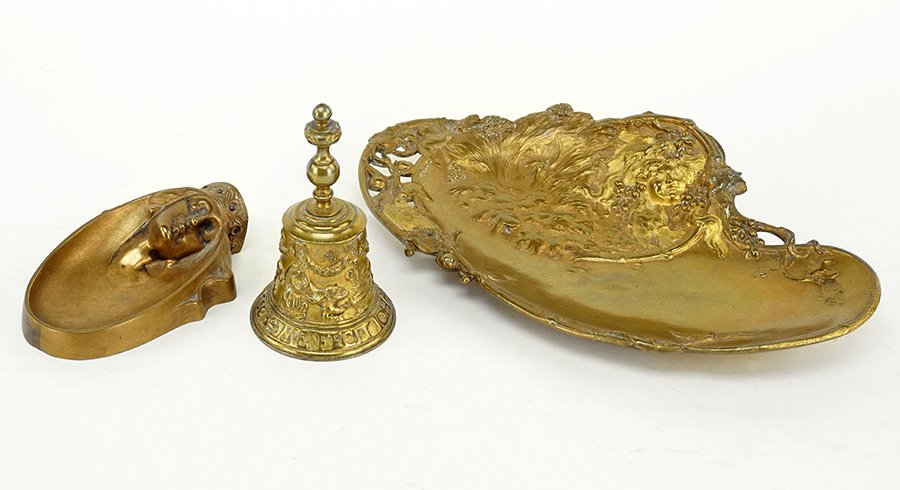 A Group of Metal Tablewares.: A Group of Metal Tablewares. Comprising an Art Nouveau card tray marked 'T. Hingre', a small figural tray, and a bell Hingre: 11" x 6.25"