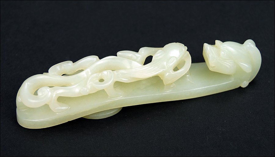 A Chinese Qing Period Celadon Jade Belt Hook. (1 of 5)