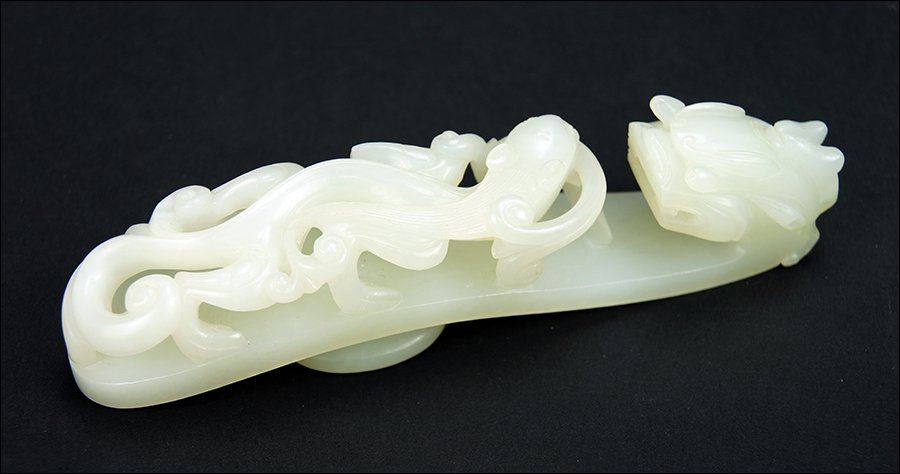 A Chinese Qing Period Carved White Jade Belt Hook. (1 of 5)