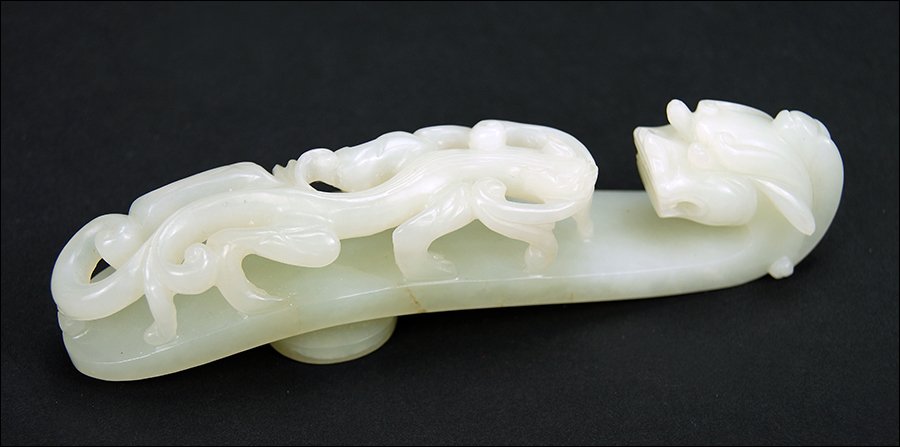 A Chinese Qing Period Carved White Jade Belt Hook. (1 of 5)