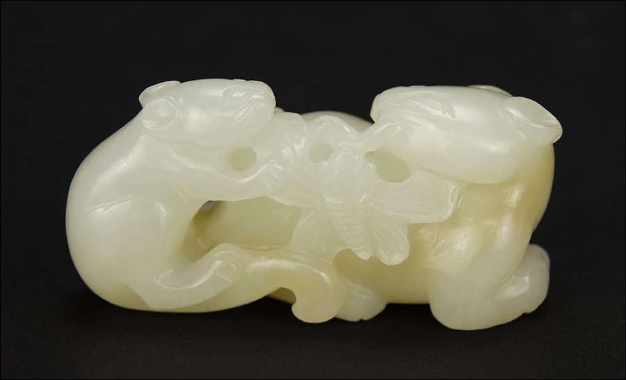 A 19th Century Chinese Carved White Jade Figure of a (1 of 3)