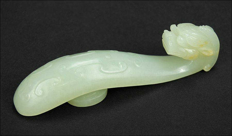 A 19th Century Chinese Carved White Jade Belt Hook. (1 of 5)