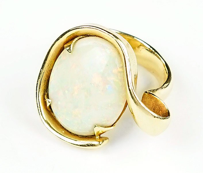 An Opal and 14 Karat Yellow Gold Ring. (1 of 1)