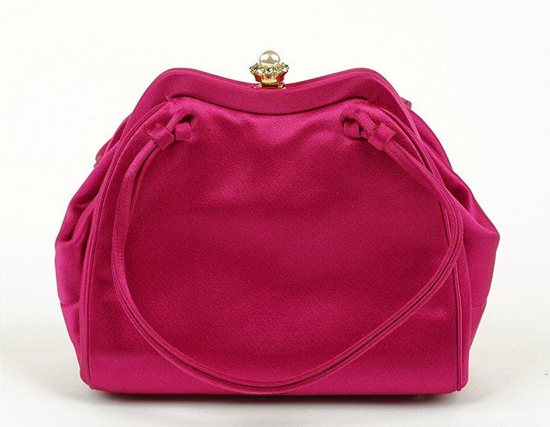 A Judith Leiber Pink Satin Handbag.: A Judith Leiber Pink Satin Handbag. Clasp contains one faux pearl and eleven rhinestones 5.5" x 6"