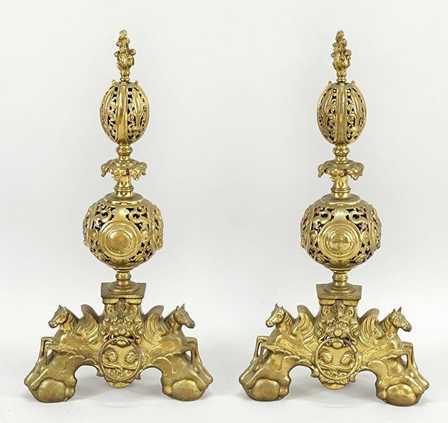 A Pair of Italian Baroque Style Andirons.: A Pair of Italian Baroque Style Andirons. Center pierced globes with an oval flower form above flame finials all atop figural sea horses Height: 34"