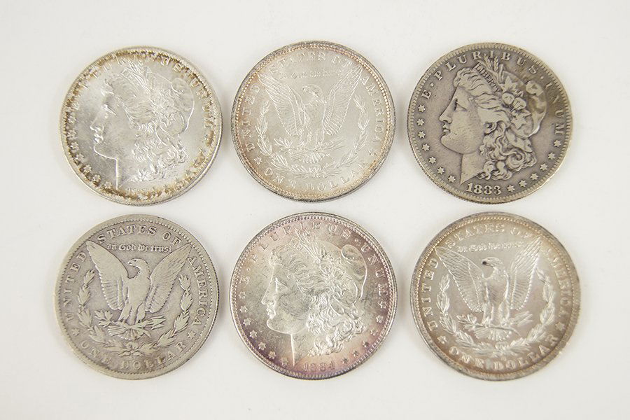 Six Morgan Silver Dollars. (1 of 3)