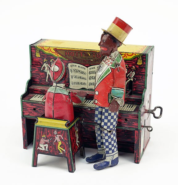 A Hott an Tott Windup Tin Toy.: A Hott an Tott Windup Tin Toy. Made by Unique Art Mfg Co, circa 1921. Banjo missing 8" x 7.5"