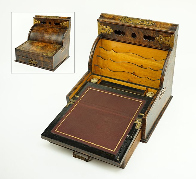 An American Burlwood Traveling Desk.: An American Burlwood Traveling Desk. Comprising a lower storage drawer and roll top which are connected. Roll top opens to reveal fruitwood letter storage. Top of desk opens to reveal inkwell storage.
