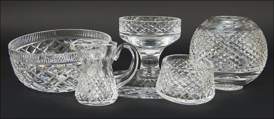A Collection of Waterford Crystal.: A Collection of Waterford Crystal. Comprising a footed cake plate, a rose bowl, a creamer and sugar, and a serving bowl Serving bowl: 8" x 3.5"