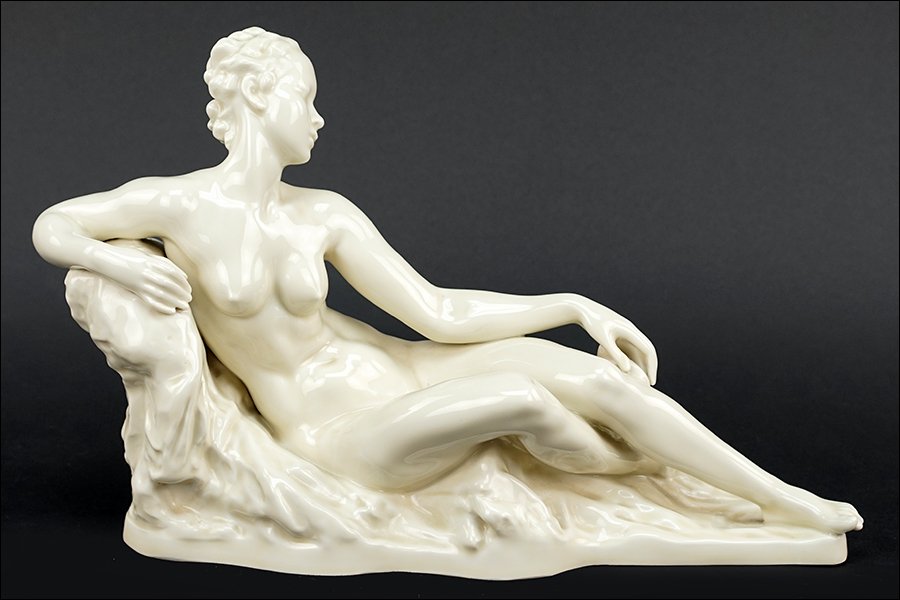 A Rosenthal Porcelain Figure of a Nude Reclining: A Rosenthal Porcelain Figure of a Nude Reclining Maiden. Reverse is impressed "Bredow" 9.5" x 13" x 4"