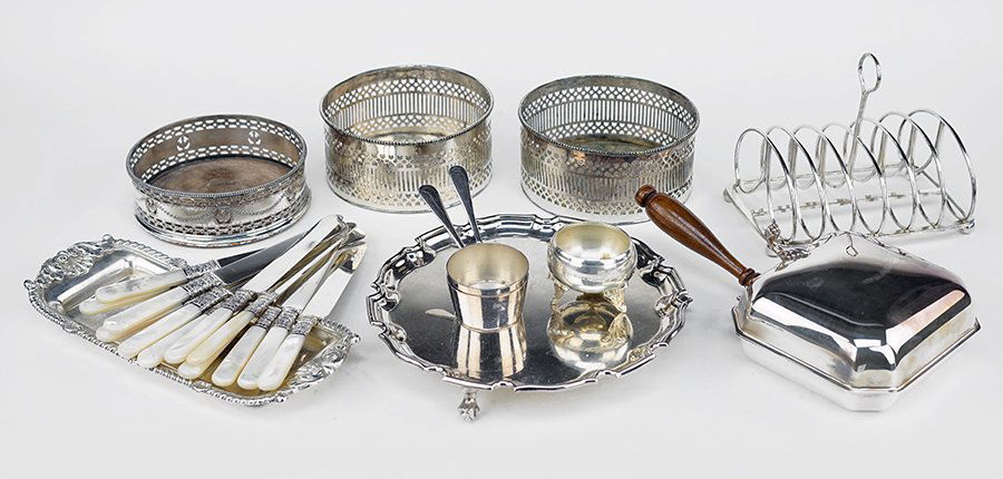 A Pair of English Silver Wine Coasters.: A Pair of English Silver Wine Coasters. Together with an English silverplate wine coaster, a set of twelve mother-of-pearl handle knives, a toast rack, a silent butler, a salver, a salt cellar, and ot