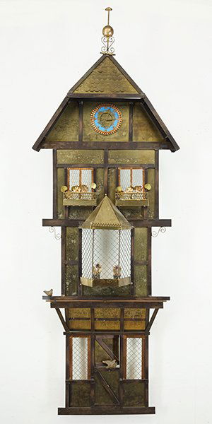 A Curtis Jere Wall Mounted Sculpture.: A Curtis Jere Wall Mounted Sculpture. Depicting a European building with clock tower. Signed "C. Jere" along the lower edge 54.5" x 19" x 7.5"