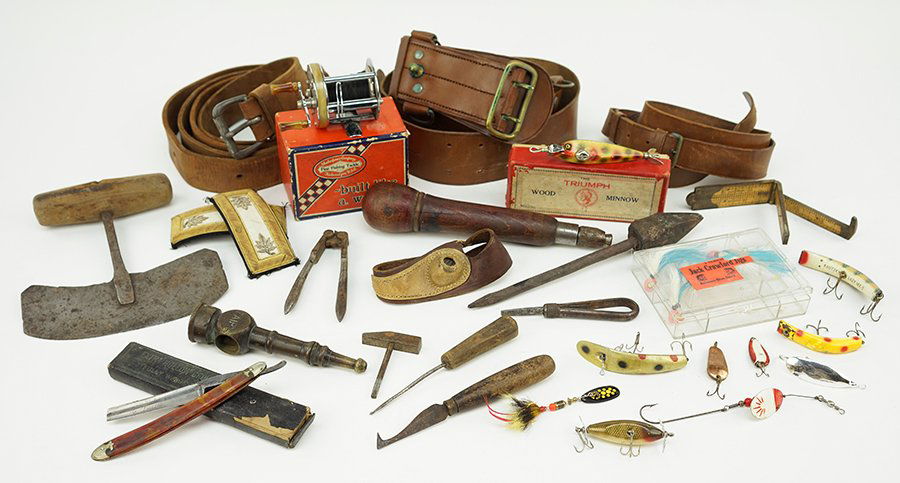 A Collection of Decorative Objects.: A Collection of Decorative Objects. Comprising a Shakespeare Triumph Reel, a group of fishing lures, a group of vintage hand tools, a straight razor, a pair of epaulets, and three work belts