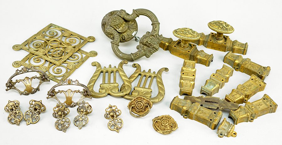 A Collection of Mountings and Hardware.: A Collection of Mountings and Hardware. Comprising a pair of doorknobs, a set of six feet mountings, a pair of lyre form mountings, two pairs of drawer pulls, a set of five drawer pulls, a pair of gra
