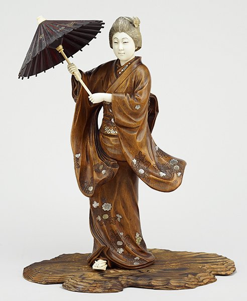 A Chinese Carved Wood Figure of a Woman with Parasol. (1 of 7)