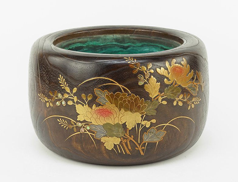A Late 19th / Early 20th Century Japanese Elm and: A Late 19th / Early 20th Century Japanese Elm and Lacquered Hibachi. Cylindrical form with lacquered and abalone chrysanthemum and leaf motif, with a metal liner 9" x 13"