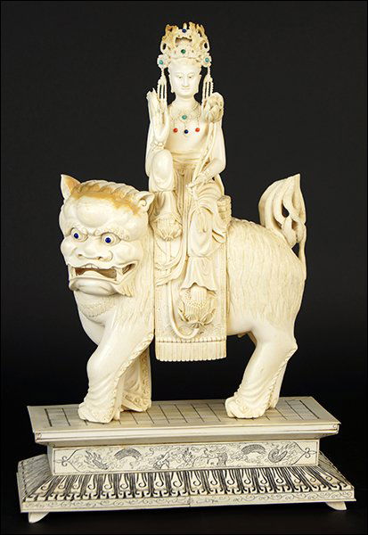 A Chinese Carved Ivory Figural Group. (1 of 2)