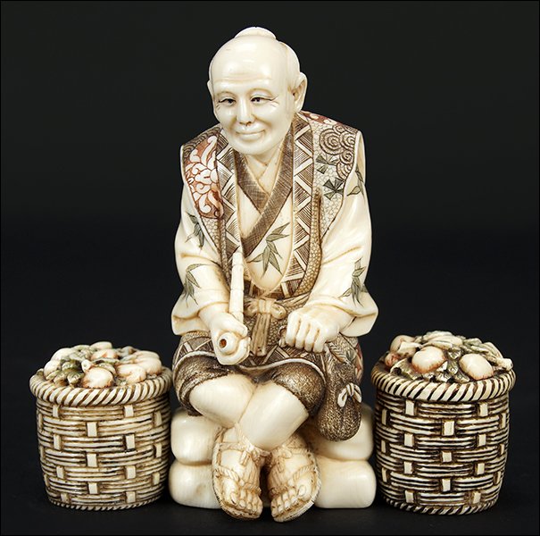 A Chinese Carved and Polychrome Decorated Ivory Figure. (1 of 2)