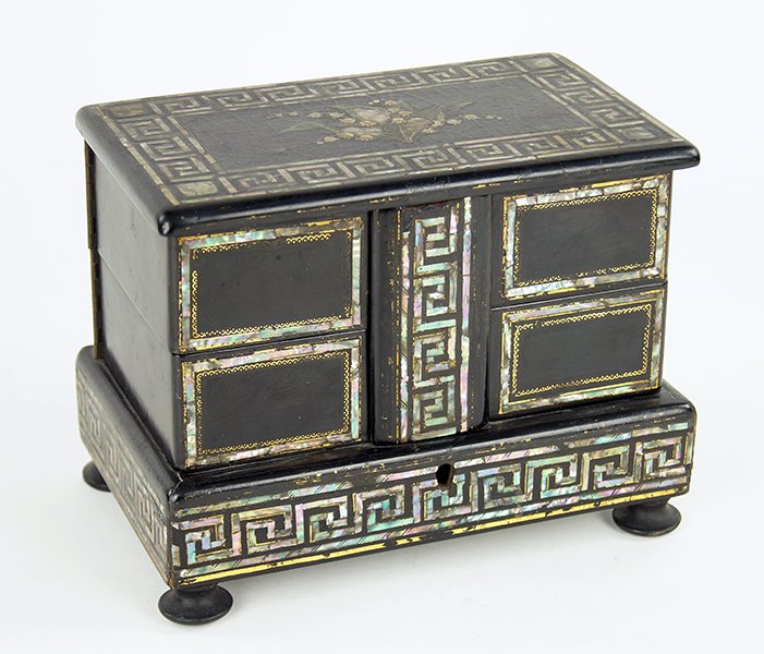 An English Papier Mache Jewelry Box.: An English Papier Mache Jewelry Box. Cover and attached central Greek key decorated support lift up so the four drawers beneath can swing out for jewelry storage. Lower border, cover border and centra