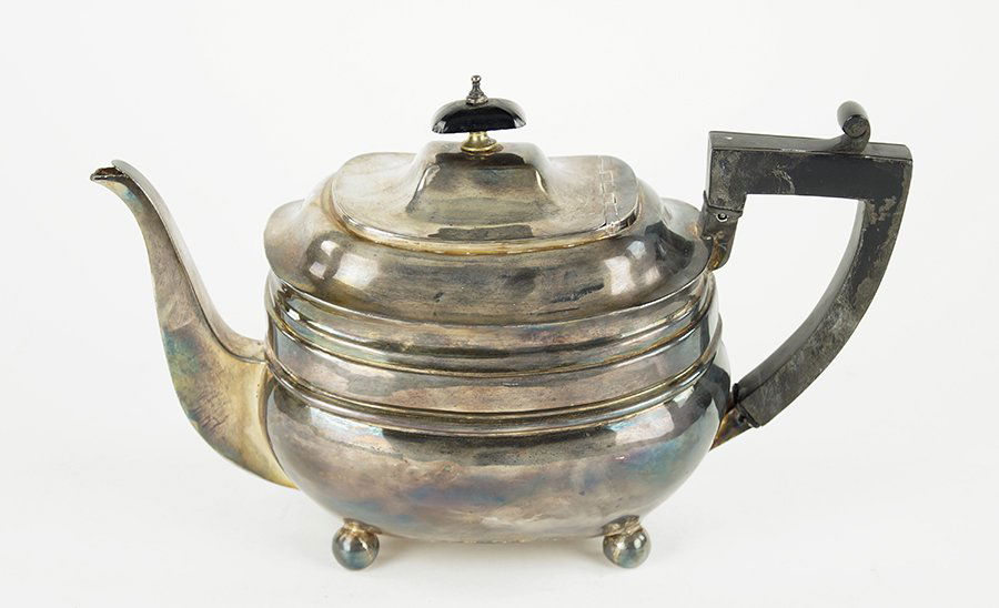 An English George III Silver Teapot.: An English George III Silver Teapot. Ebony handle with rounded body, raised on ball feet. London, 1808 6" x 10" x 4.5" Wt: 13.55 ozt