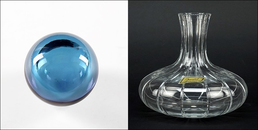 A Baccarat Crystal Wine Decanter.: A Baccarat Crystal Wine Decanter. With a Baccarat amethyst glass round ball stopper. Together with two original boxes Decanter with ball stopper: 10" x 8"