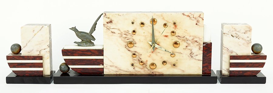 An Art Deco Clock and Garniture. (1 of 2)