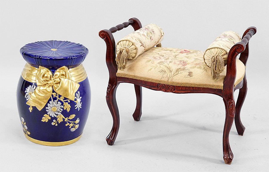 An English Laced Ceramic Garden Seat.: An English Laced Ceramic Garden Seat. Cobalt ground garden seat with silver and gold gilt decoration. Together with a carved mahogany vanity bench with needlepoint cushion and bolster pillows Bench: 2