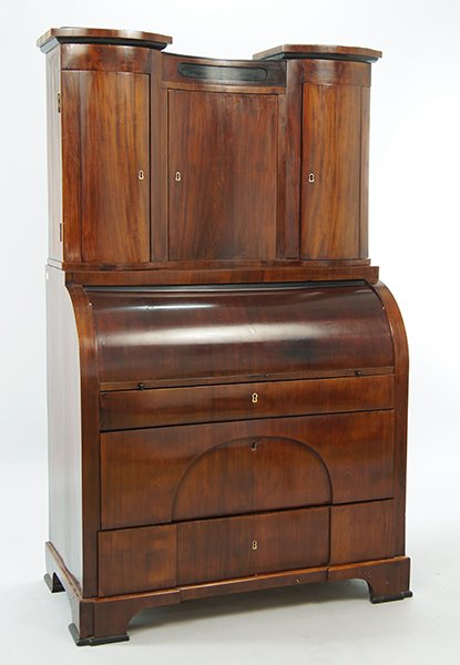 A Biedermeier Roll Top Secretary.: A Biedermeier Roll Top Secretary. Roll top desk opens to reveal a central Palladian style temple flanked by arch top doorway drawers, further flanked by three stacked drawers on either side. Bureau sl