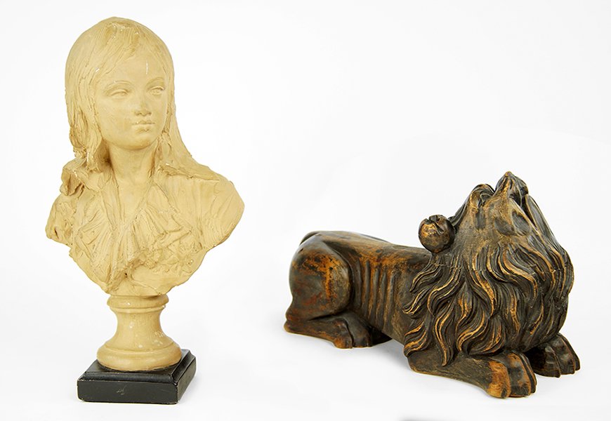 A Continental Carved Oak Dog.: A Continental Carved Oak Dog. Depicted crouching on all fours with head looking upwards. Together with a painted plaster bust of a young boy (15.5" x 9" x 5") Dog: 8.5" x 14" x 6"