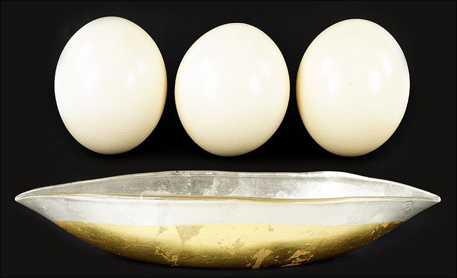Three Ostrich Eggs.: Three Ostrich Eggs. Together with a gold and silver leaf decorative glass bowl Bowl: 3.5" x 19" x 7.5"