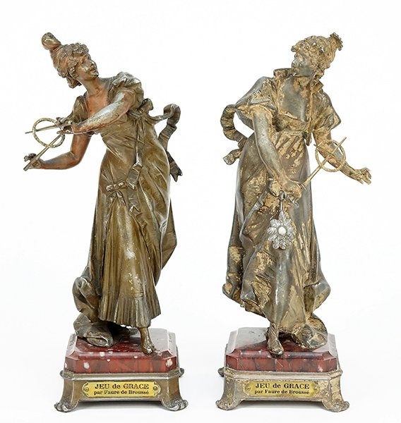 A Pair of French Patinated Metal Figures.: A Pair of French Patinated Metal Figures. Two maidens depicted in flowing gowns with game pieces raised on rouge marble bases each bearing a plaque reading 'Jeu de Grace par Faure de BroussÃ©' Overa