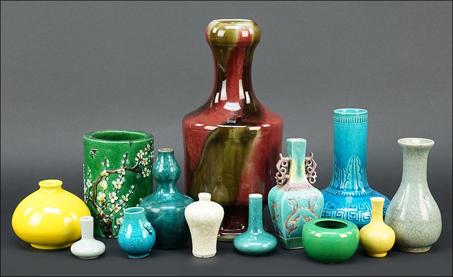 A Collection of Chinese Porcelain Articles.: A Collection of Chinese Porcelain Articles. Comprising a brush pot and an assortment of vases in varying sizes Tallest: 11"