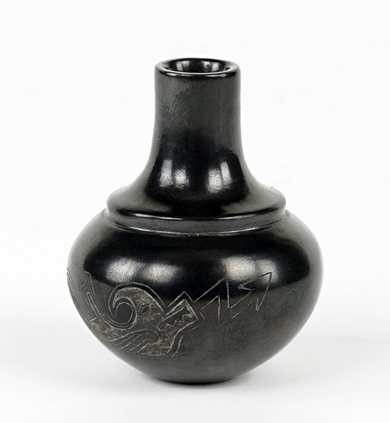 Nancy Youngblood Cutler (B. 1955) A Cabinet Vase.: Nancy Youngblood Cutler (B. 1955) A Cabinet Vase. Blackware vase with Sgraffito decoration along the bulbous lower half. Underside is signed and dated 1980 2.25" x 2"