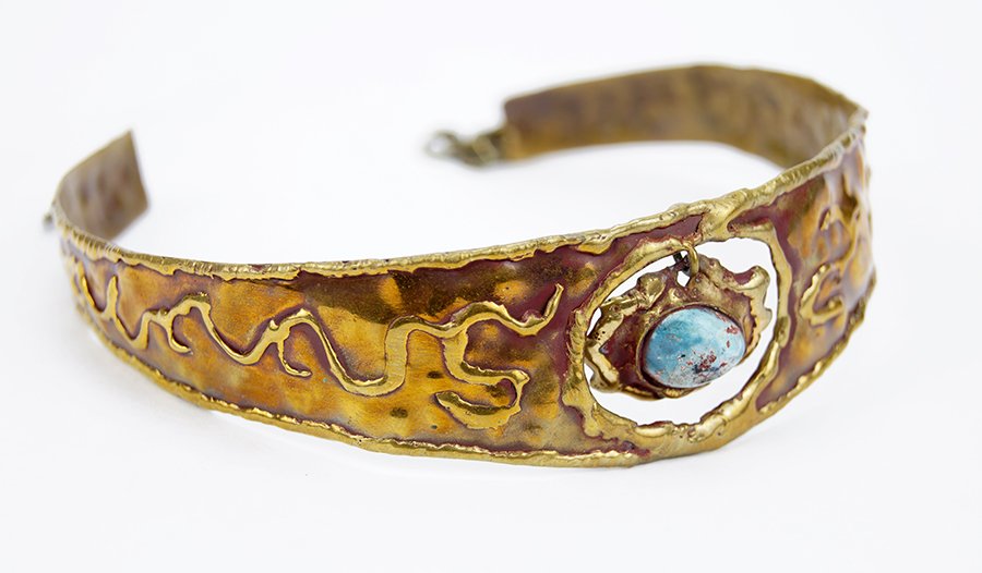 A Pal Kepenyes Choker.: A Pal Kepenyes Choker. Hammered metal with an articulated pendant containing a turquoise cabochon. Interior diameter: 4.25" Overall circumference: 14.25"