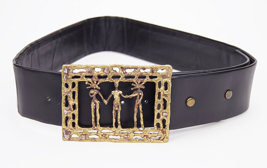 A Pal Kepenyes Belt Buckle.: A Pal Kepenyes Belt Buckle. Depicting three nude figures. Together with a black belt Buckle: 4.25" x 3.25"