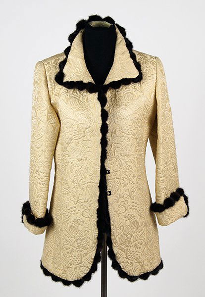 A Cream Jacquard and Mink Jacket.: A Cream Jacquard and Mink Jacket. Perimeter of entire jack and foldover cuffs trimmed in black mink, with slash pockets