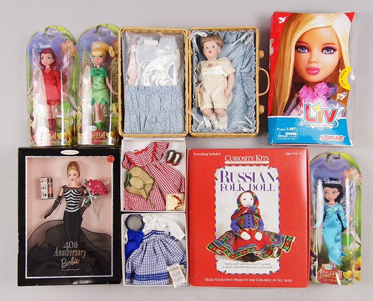 Group of New In the Box Dolls.: Group of New In the Box Dolls. Consisting of Christmas Madame Alexander, Wendy Lawton, Barbies and Disney, approximately eighteen dolls