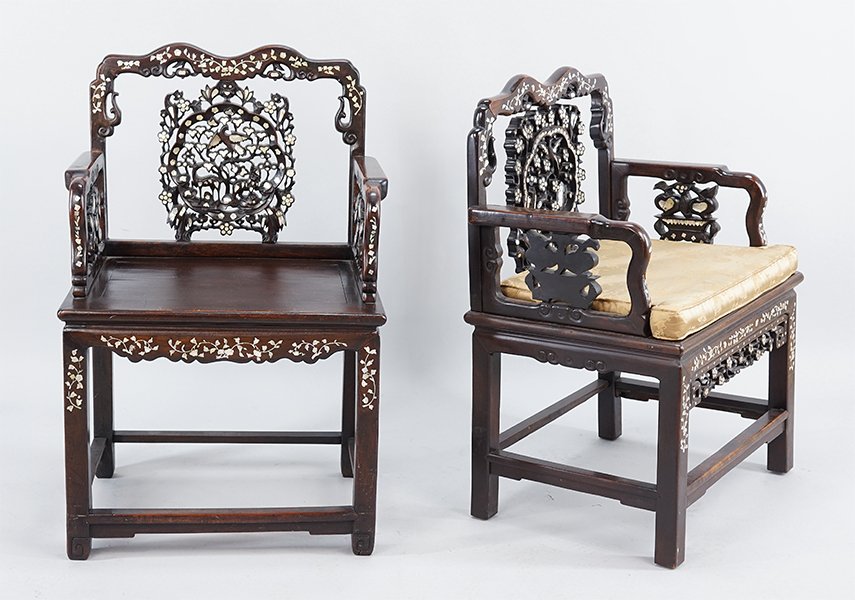 A Pair of Chinese Carved Wood Armchairs.: A Pair of Chinese Carved Wood Armchairs. Both chairs are inlaid with floral abalone decoration 39" x 24.5" x 19"