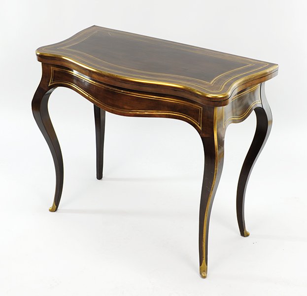 A Continental Flip Top Games Table.: A Continental Flip Top Games Table. Brass bound mahogany table opens to reveal a green felt top games table and ebonized table top Open: 28" x 34" x 34" Closed: 28" x 34" x 17"