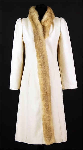 A White Wool Coat.: A White Wool Coat. Trimmed at collar and closure in opossum fur Approximate 6
