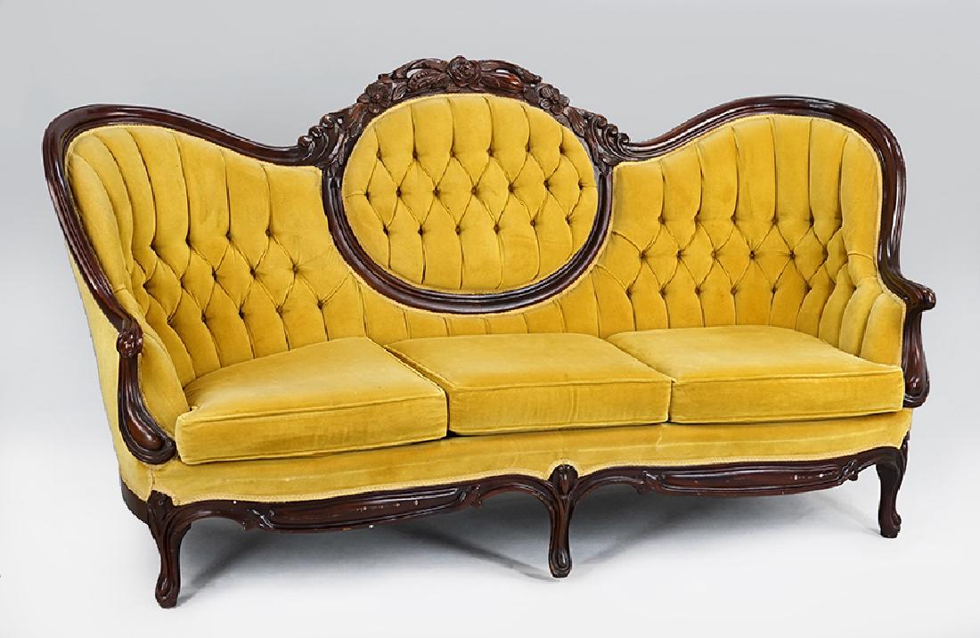 A Victorian Style Carved Walnut Sofa. (1 of 1)