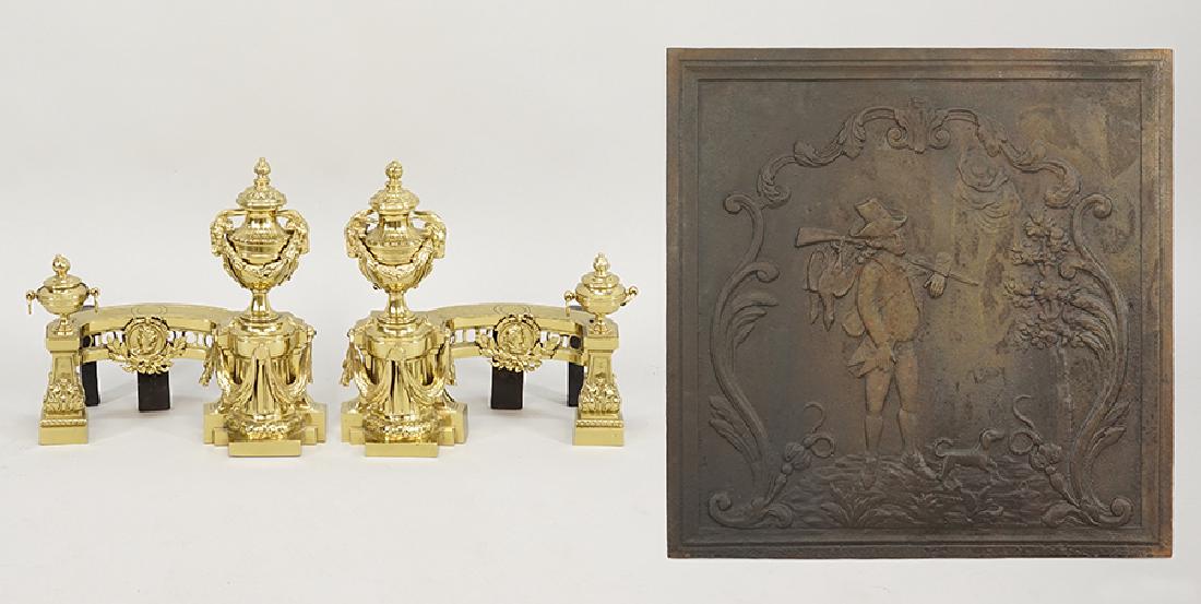 A Pair of Gilt Metal Andirons.: A Pair of Gilt Metal Andirons. Together with a cast iron fire back (23.5" x 23.5")