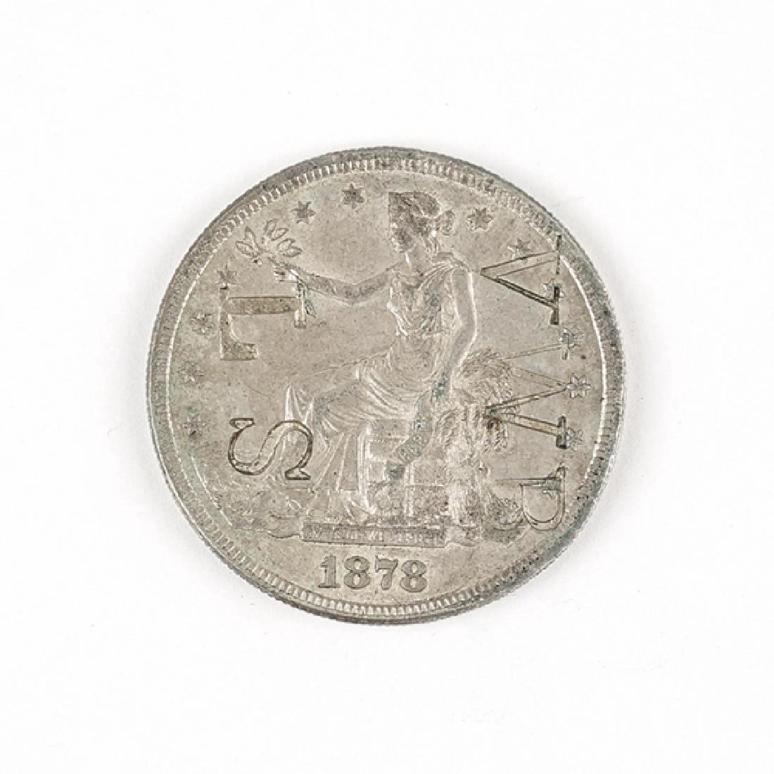 An 1872 Seated Liberty Trade Silver Dollar. (1 of 2)