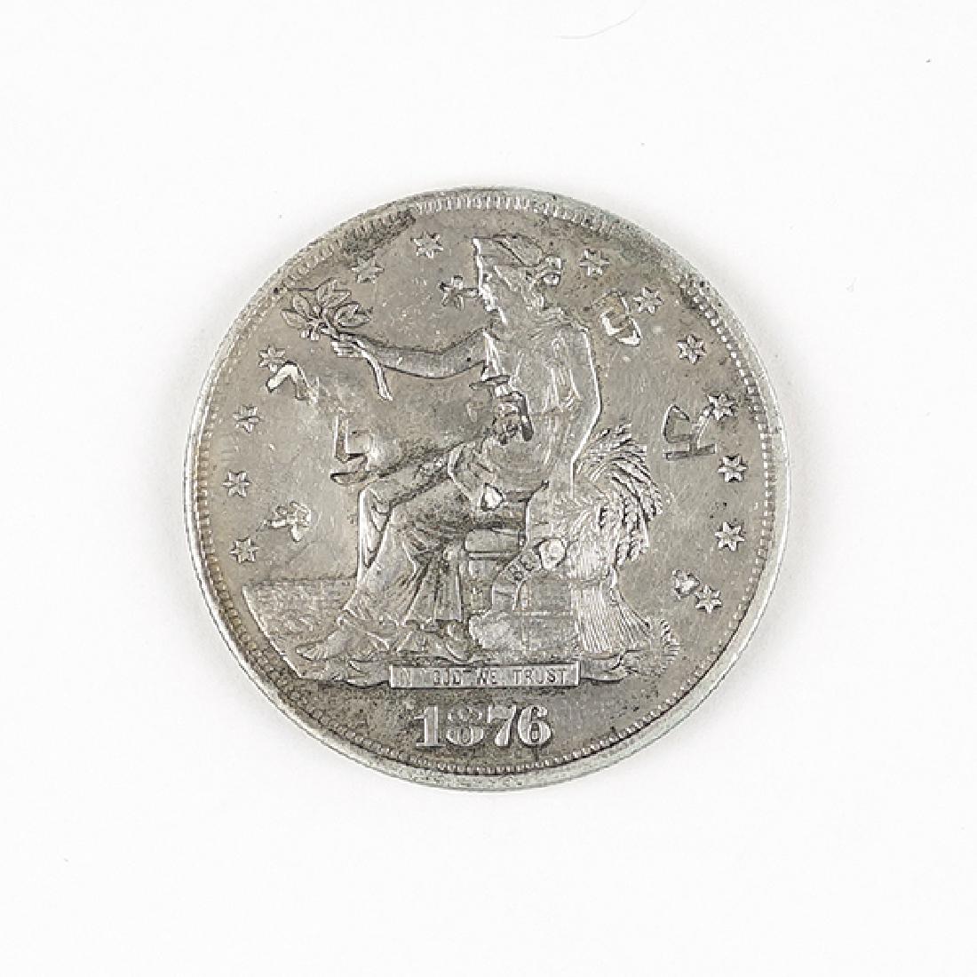 An 1876-CC Seated Liberty Trade Silver Dollar. (1 of 2)