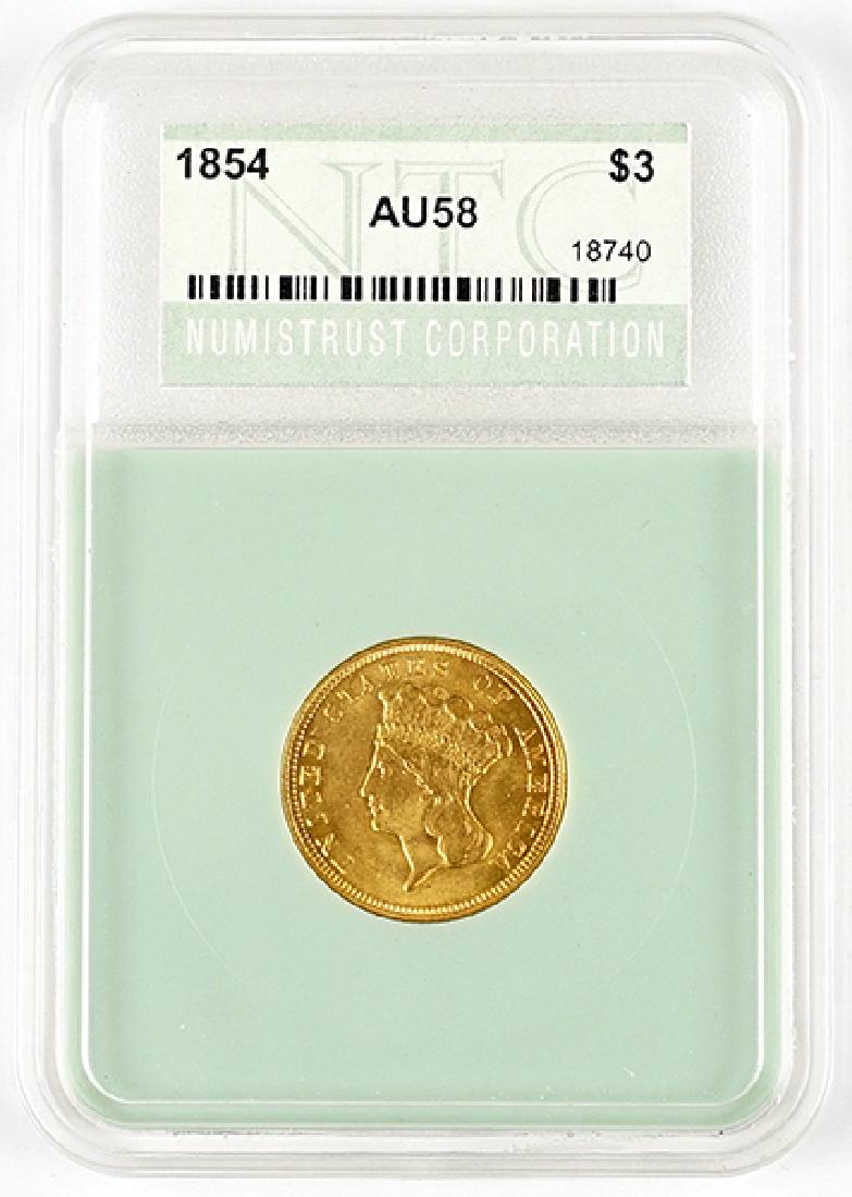 An 1854 $3 Indian Princess Gold Coin. (1 of 2)