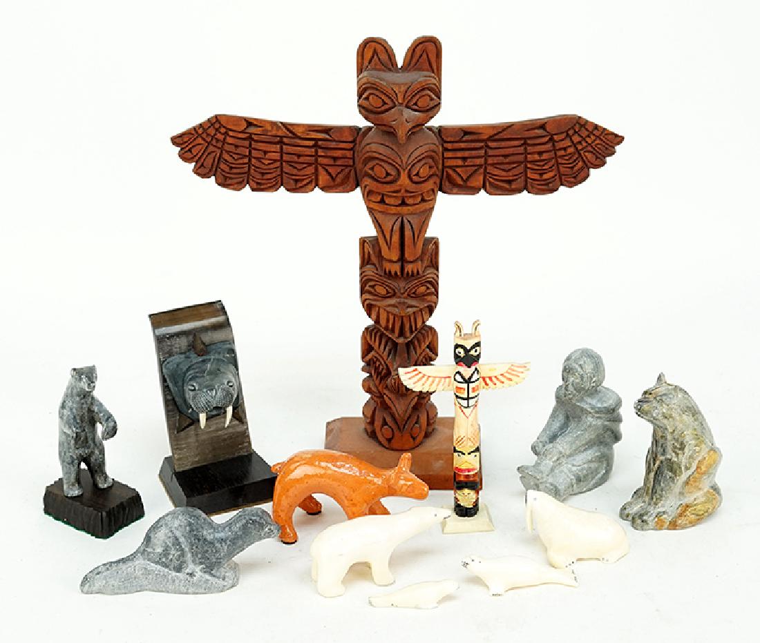 A Collection of Inuit Carvings.: A Collection of Inuit Carvings. Comprising carved soapstone and bone animals. Together with two totemic figures