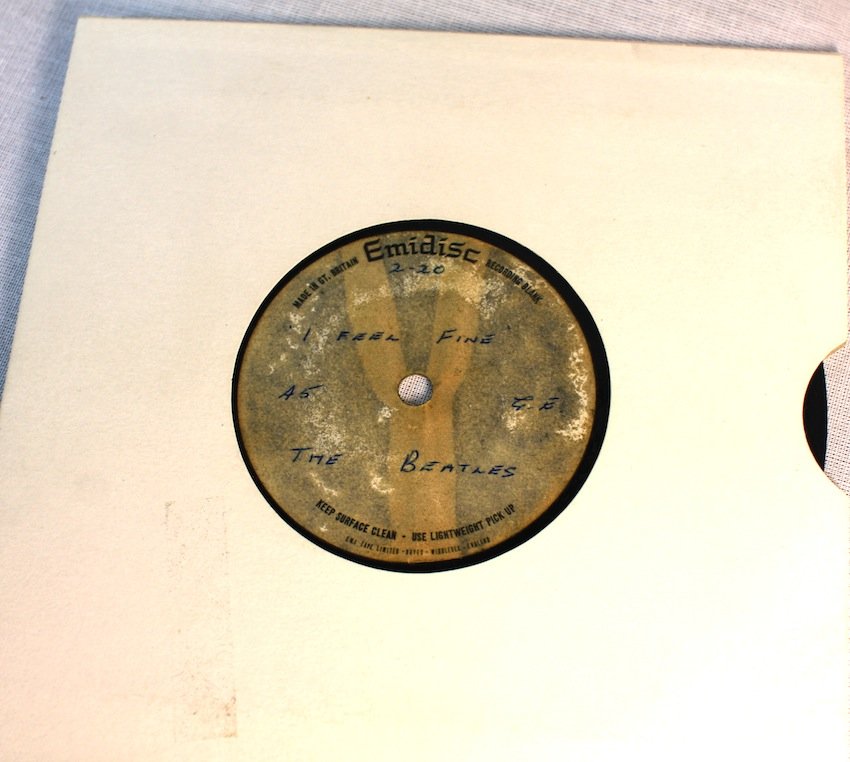 The Beatles "I Feel Fine" Acetate: The Beatles "I Feel Fine" Acetate. A one sided 7" 45rpm acetate with a handwritten Emidisc label reading "2:20 I Feel Fine, 45 G.E The Beatles" in blue ballpoint pen. This John Lennon composition was